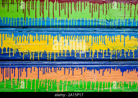 Colorful wooden background of peeling cracked surface. Abstract pattern in rustic style. Dripping paint Stock Photo