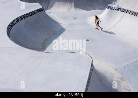 Young woman inline skating in skatepark Stock Photo
