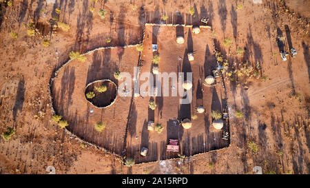 Aerial view of Txitundo Hulo, village Kimbos, surrounded by village fence, in Angola Stock Photo