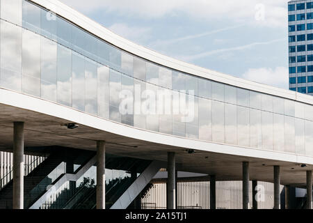 Reflections of clouds on glass facade of modern building, Barcelona, Spain Stock Photo