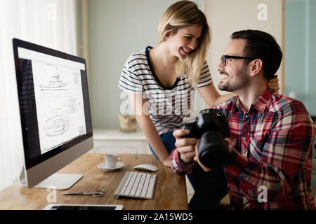 Young attractive designers working together from home Stock Photo