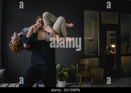 Father and son having fun together at home Stock Photo