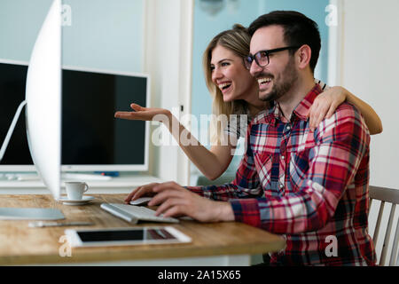 Young attractive designers working together from home Stock Photo