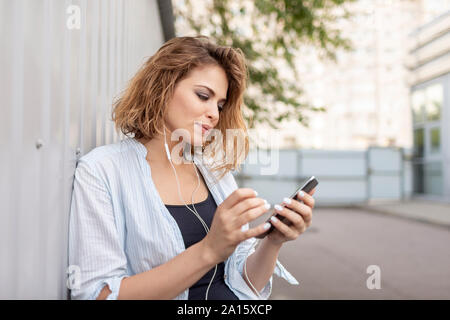 East European woman using smartphone Stock Photo