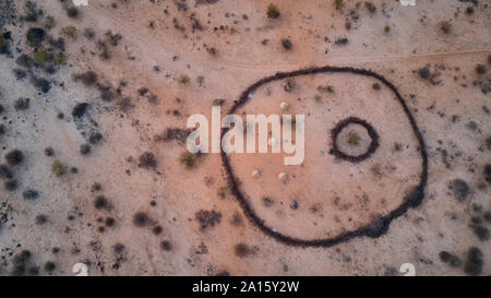 Aerial view of Txitundo Hulo, village Kimbos, surrounded by village fence, in Angola Stock Photo