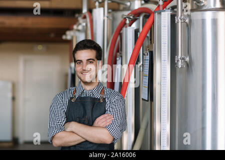 Portrait of confident young brewer at a brewery Stock Photo