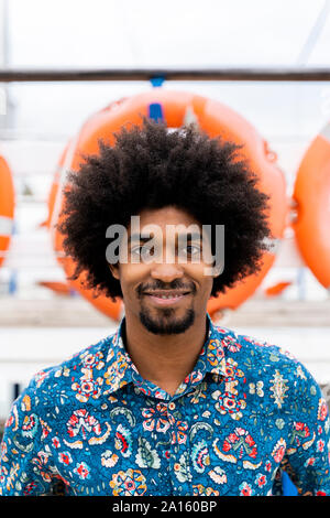Portrait of smiling stylish man wearing funky shirt Stock Photo