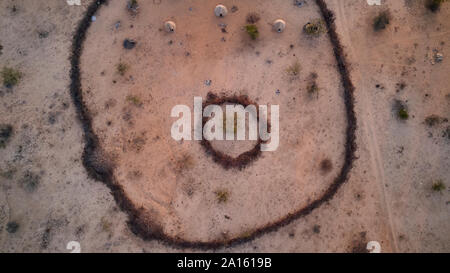 Aerial view of Txitundo Hulo, village Kimbos, surrounded by village fence, in Angola Stock Photo