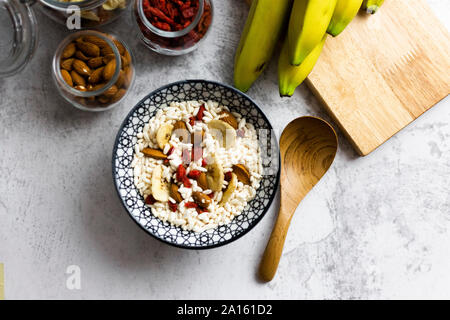 Bowl of fresh muesli and ingredients seen from above Stock Photo