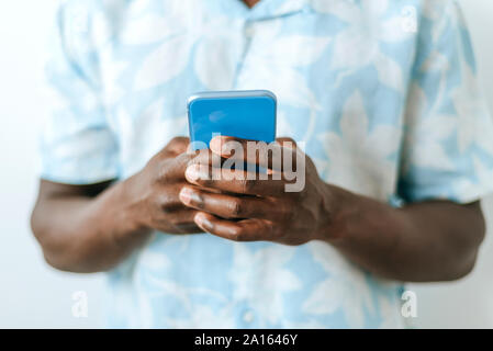 Close-up of man holding cell phone Stock Photo