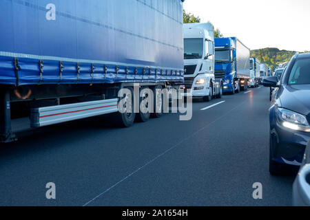 Rescue lane, cars and trucks during traffic jam in the evening, Germany Stock Photo