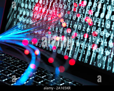 Cyber Attack, Fibre optics containing a virus infecting a computer Stock Photo