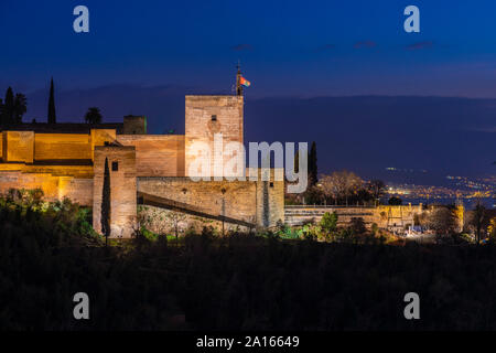 View of Alhambra with Sierra Nevada in the background at night, Granada, Spain Stock Photo