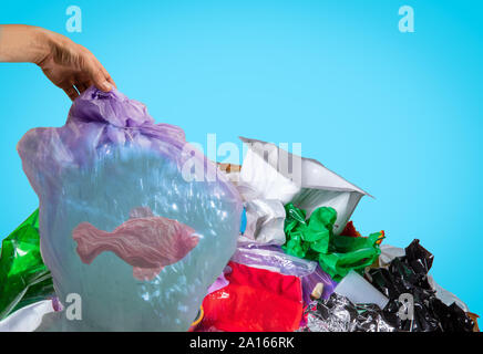 Stop plastic - concept of environmental pollution. Clear water polluted of polymer garbage. Floating fish in bag. Ecology, healthcare, planet's problems of cleaning, animals and plants. Stock Photo