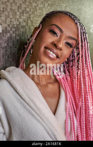 Portrait of young woman with pink braids Stock Photo