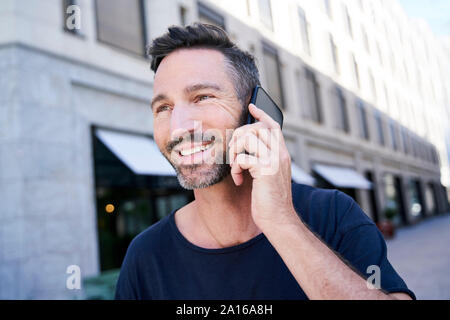 Portrait of mature man using smartphone Stock Photo