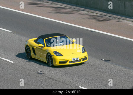 2016 yellow Porsche 718 Boxster S S-A; UK Vehicular traffic, transport, modern, saloon cars with private number plate, personalised, cherished, dateless, DVLA registration marks, registrations, saloon cars, south-bound on the 3 lane M6 motorway highway. Stock Photo