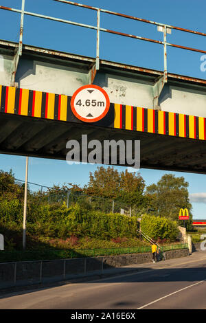 Railway bridge height restriction 4.65 m headroom warning sign over Park Road in Killarney, County Kerry, Ireland Stock Photo