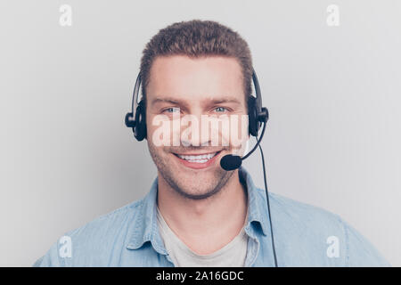 Cheerful glad positive kind assistance man having headset with m Stock Photo