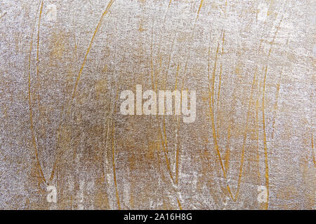 Rough golden painted surface background. Stock Photo