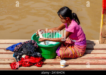 A Local Woman Washing Clothes, Lake Inle, Shan State, Myanmar Stock Photo