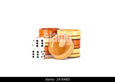 Dice and backgammon checkers isolated on a white background. Copy space. Stock Photo