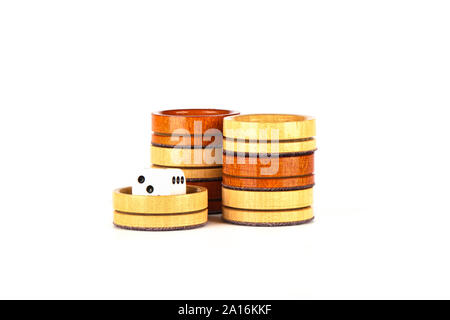 Dice and backgammon checkers isolated on a white background. Copy space. Stock Photo