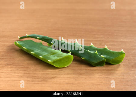 fresh aloe vera  leaf on wooden background, closeup Stock Photo