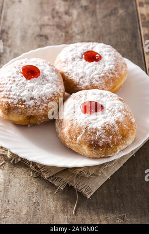 Hanukkah sufganiyot. Traditional Jewish donuts for Hanukkah. Stock Photo