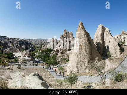 CAPPADOCIA, TURKEY - SEP 11, 2019 - Tourists explore Ancient Christian cave churches, Goreme Open Air Museum ,  Cappadocia in Turkey Stock Photo