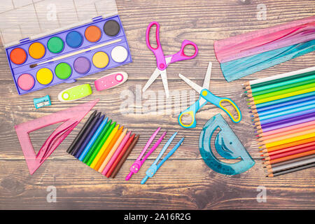 School concept - Different school supplies on the wooden table Stock Photo