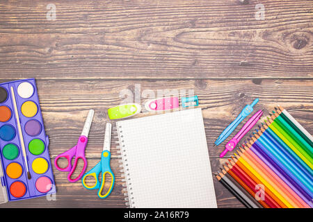 School concept - Different school supplies on the wooden table Stock Photo