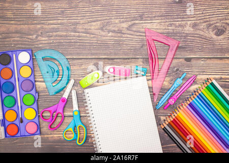 School concept - Different school supplies on the wooden table Stock Photo