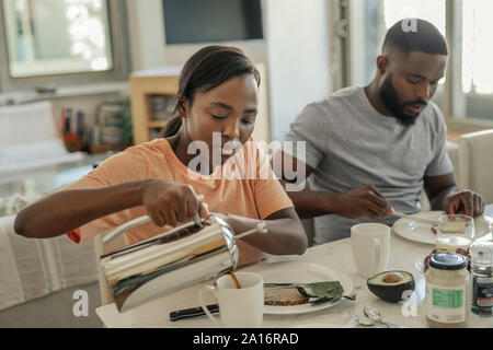 Young African American couple having breakfast at home together Stock Photo
