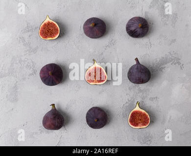 Pattern with fresh ripe figs on a gray concrete background Stock Photo