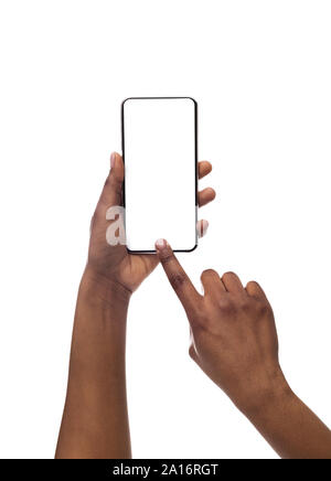 Black female hands taking photo on smartphone with blank screen Stock Photo