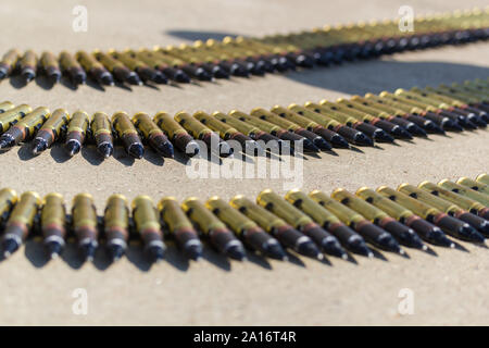 A row of ammunition cartridges - three rows of bullets in the circle. Mid shot Stock Photo