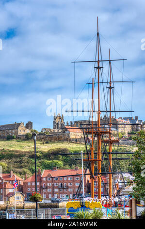 Whitby harbour with view to Whitby Abbey, North Yorkshire, UK Stock Photo