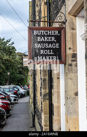 Unusual butcher’s sign in Bamburgh, Northumberland, UK Stock Photo