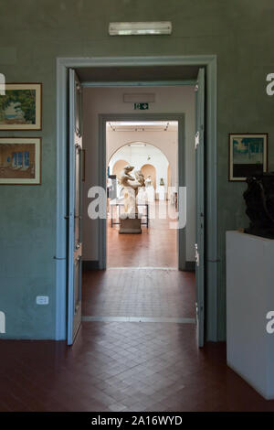 Sculpture 'Pudore' seen from adjacent room at Museo Pietro Canonica a Villa Borghese, Rome, Italy Stock Photo