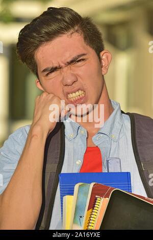 Youthful Diverse Male Student And Anger Stock Photo