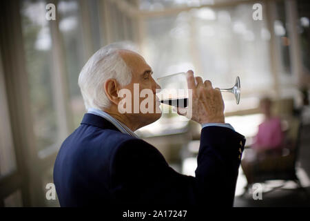 elderly man drinking  wine Stock Photo