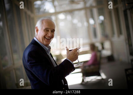 elderly man drinking wine Stock Photo