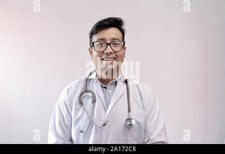 male indian doctor in white coat and stethoscope Stock Photo