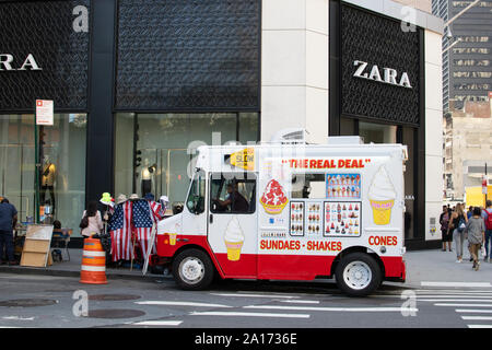 Ice cream trucks delivering sundaes, shakes and cones in front of zara shop, Financial Distict, Lower Manhattan, New York City, NYC, USA Stock Photo