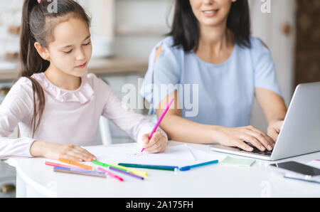 Art therapy. Little girl on reception at the psychotherapist Stock Photo