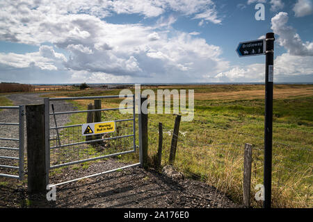 A Warning Beware of the Bull sign on the gateway to a Public Bridleway. Is the bull really there? Isle of Sheppy, Kent, England. 19 August 2019 Stock Photo