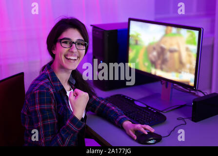 Portrait of happy pro gamer girl looking at camera Stock Photo