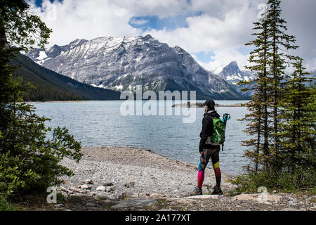 Woman hiking a trail of the Canadian Rockies in Kananaskis country, Alberta, Canada Stock Photo