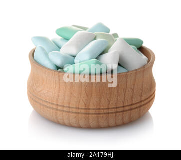 Wooden bowl of mint chewing gum pieces isolated on white Stock Photo